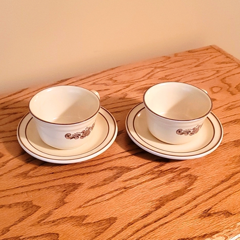 Pfaltzgraff Village cups and saucer sets.